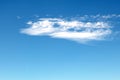 A small white cloud against a blue sky. Royalty Free Stock Photo