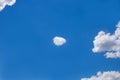 Small white cloud against the blue sky. Template for text, natural airy background Royalty Free Stock Photo