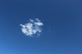 Small white cloud in clear blue sky at daytime Royalty Free Stock Photo