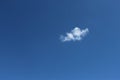 Small white cloud in clear blue sky at daytime Royalty Free Stock Photo