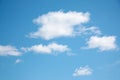 Small white clouds on light blue clear sky Royalty Free Stock Photo