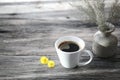 Small white coffee cup and and flowers Royalty Free Stock Photo