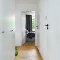 Small white corridor with wooden floor Royalty Free Stock Photo