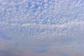 Small white cumulus clouds in blue sky Royalty Free Stock Photo