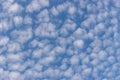 Small white cumulus clouds in blue sky Royalty Free Stock Photo