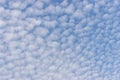 Small white cumulus clouds in blue sky Royalty Free Stock Photo