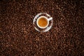 Small white cup of frothy strong espresso coffee Royalty Free Stock Photo