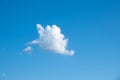 Small white fluffy cloud in blue sky. Royalty Free Stock Photo