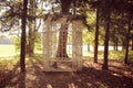Small white gazebo and bench at the edge of the forest Royalty Free Stock Photo