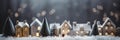 Small white houses of work with illuminated windows stand in the snow .