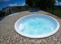 small white jacuzzi with blue water Royalty Free Stock Photo