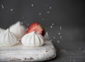 Small white meringues with strawberries