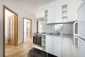Small, white modern kitchen interior design Royalty Free Stock Photo