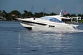 Small white motor yacht on the Florida Intra-Coastal Waterway Royalty Free Stock Photo