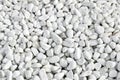 Large and small clean white oval pebbles.