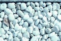Small white pebbles texture closeup. Natural background blue color toned Royalty Free Stock Photo