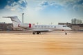 Small white plane at the airport. Runway. Charter flight. Flight on a journey. Fly in a private jet. New beautiful Royalty Free Stock Photo