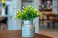 White plastic flowers in a pot on a table Royalty Free Stock Photo