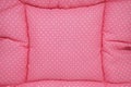 Small white polka dots on pink background fabric Royalty Free Stock Photo