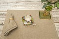 A small white porcelain cup on a gray cloth placemat Royalty Free Stock Photo