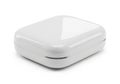 A small white rectangular electronic device with rounded edges isolated on white background Royalty Free Stock Photo