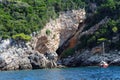 Small yacht anchored at scenic rocks near Dubrovnik Croatia