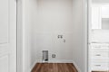 Small, white room with a white door and a white wall Royalty Free Stock Photo