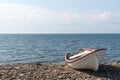 Small rowing boat by the coast