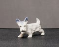 Small white Scottie dog sculpture of unknown origins