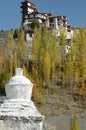 A small white shrine below a Buddhist monastery in Leh, Ladahkh Royalty Free Stock Photo