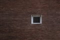 Small white window and red bricks wall Royalty Free Stock Photo