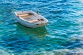 Small white wooden boat on Adriatic Sea Royalty Free Stock Photo