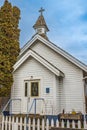 Small white wooden church in the country. A little white country church in rural Canada Royalty Free Stock Photo