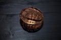 Small basket on a dark wooden background.