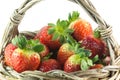 Small wicker basket with strawberries Royalty Free Stock Photo