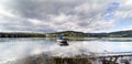 Small wide-angle photo small boat tied to shore with ropes cover