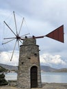 Small wind tower on Elounda harbour Royalty Free Stock Photo