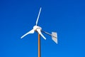 Small Wind Turbine on Blue Sky