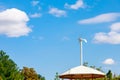 Small wind turbine on the roof of the stop for night lighting. Green technologies. Blurred movement of the paddles