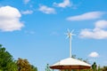 Small wind turbine on the roof of the stop for night lighting. Green technologies. Blurred movement of the paddles