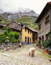 Small winding Street with old typical houses in a cloudy spring day, Cain de Valdeon, Picos de Europa, Castile and Leon, Spain Royalty Free Stock Photo