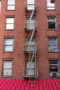 Small Window Fire Escape on a Brick Building in Tribeca New York Royalty Free Stock Photo