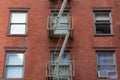 Small Window Fire Escape on a Brick Building in Tribeca New York Royalty Free Stock Photo