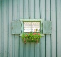 Small window with flowers Royalty Free Stock Photo