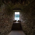 Small window overlooking Loch Ness from Urquhart Castle, construction of the Middle Ages, Scotland. Royalty Free Stock Photo