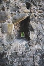 A small window in a stone fortress. Royalty Free Stock Photo