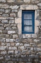 Small window on a stone wall