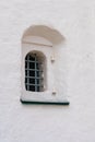 Yaroslavl, Russia, July 4, 2023. A small window of an old church with iron bars. Royalty Free Stock Photo