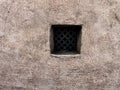A small window in the wall of an old building in Kyiv Royalty Free Stock Photo