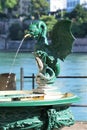 Elaborate green drinking fountain with dragon spout